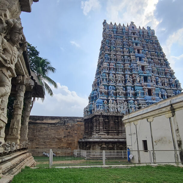 A temple with statues in front of it.